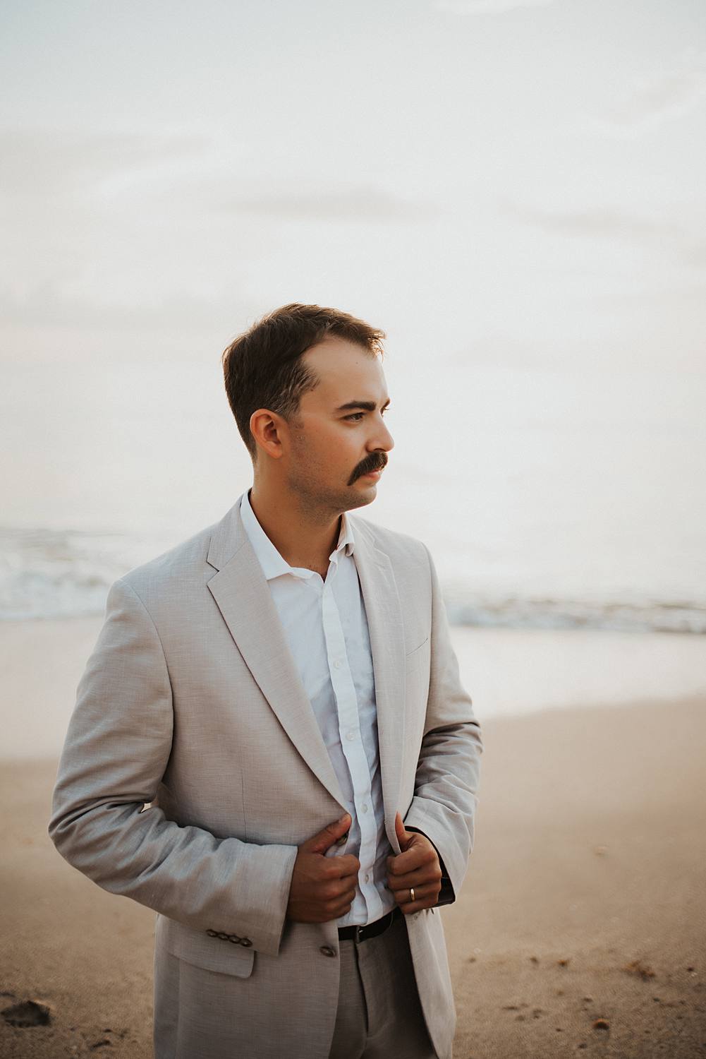 Groom portrait on beach