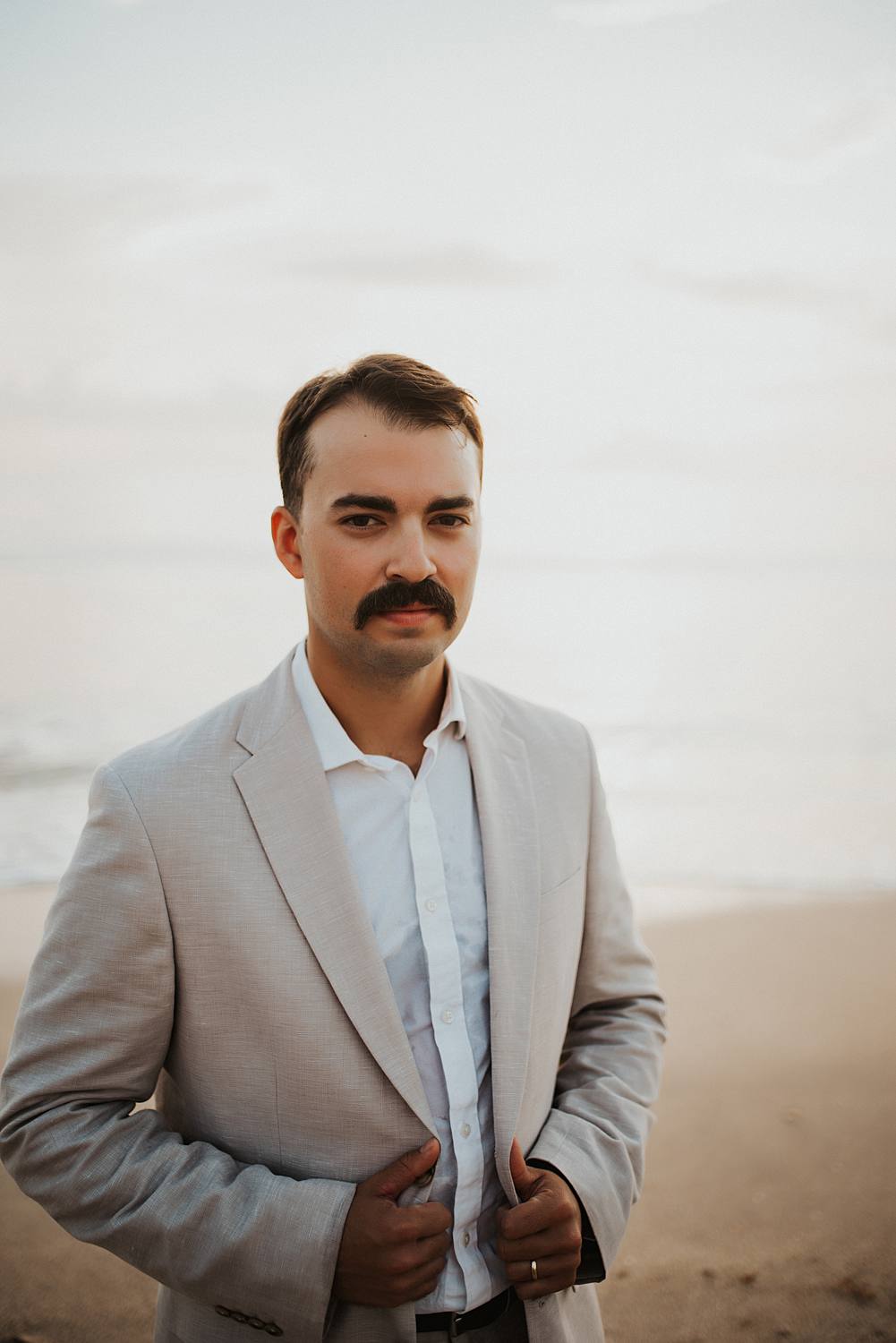 Groom portrait on beach