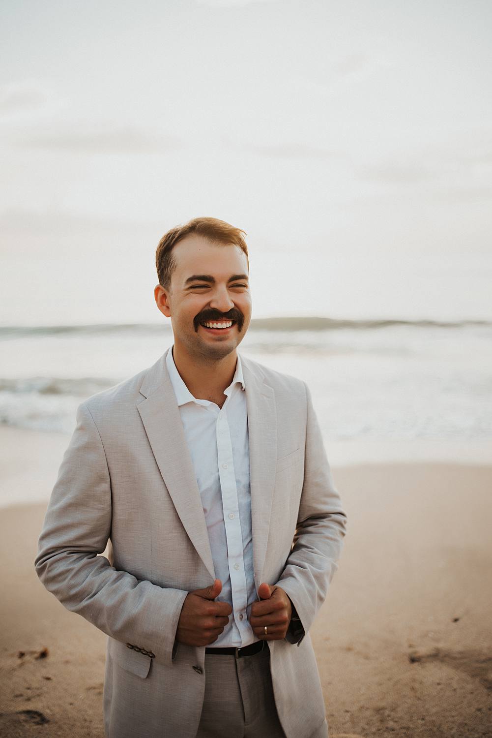 Groom portrait on beach