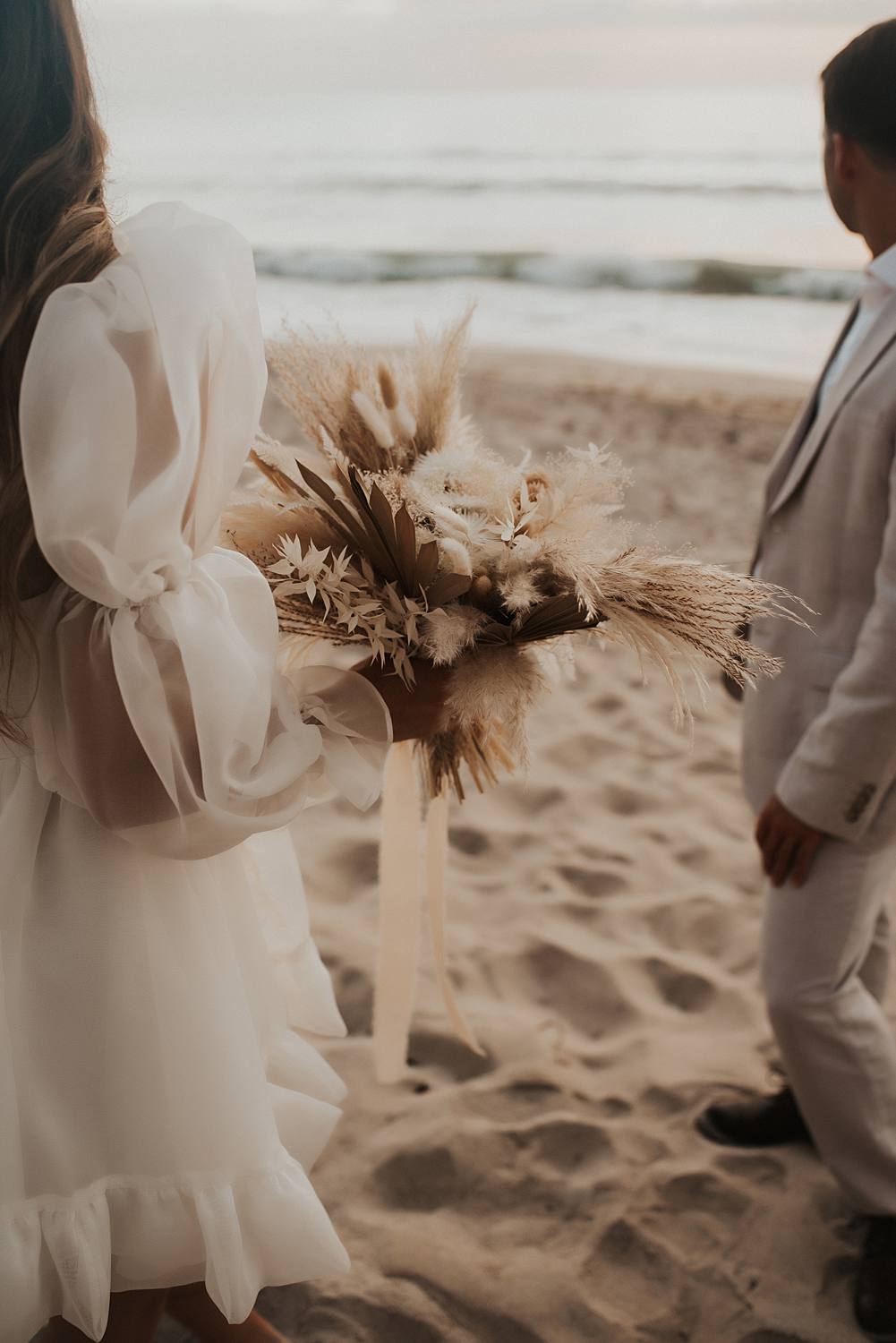Dried flower bouquet on beach