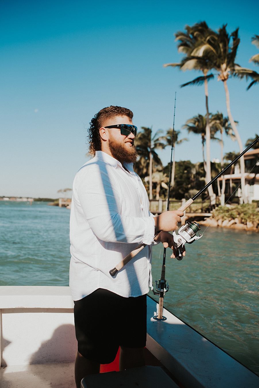 Groom fishing during elopement