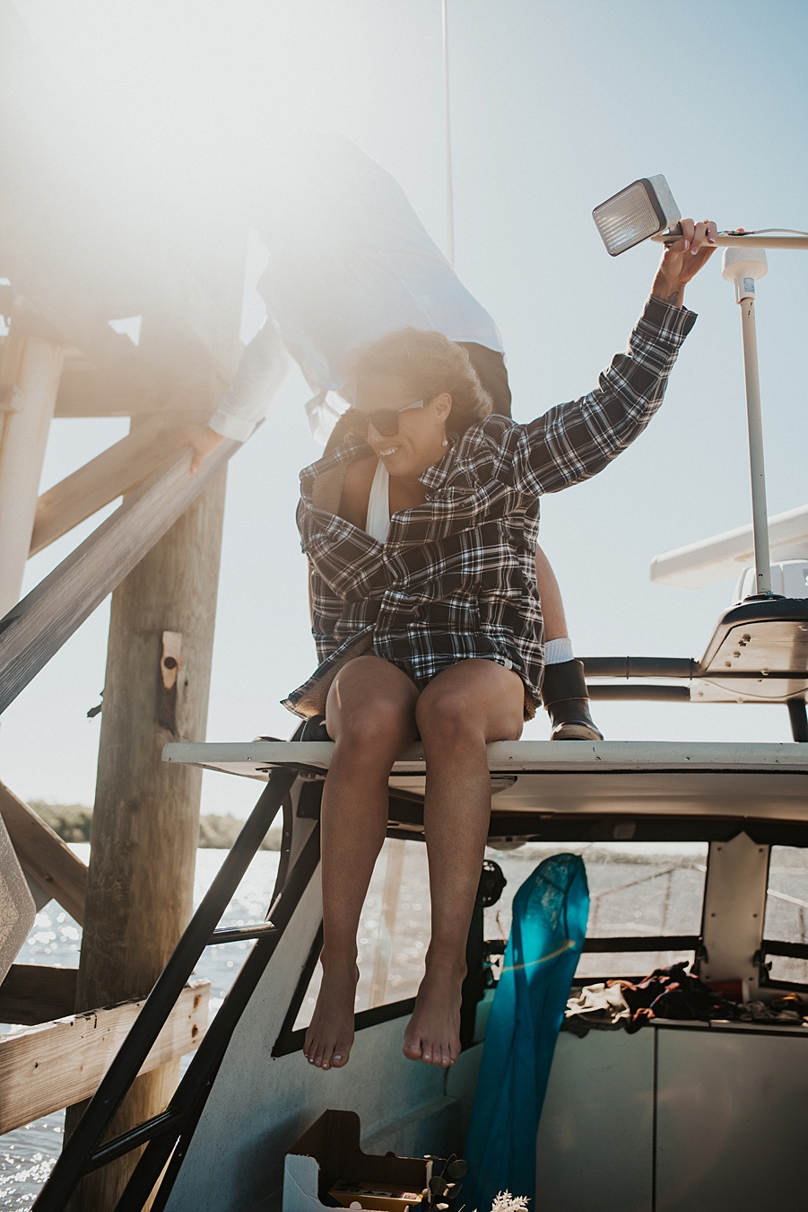 Bride sitting on top of boat