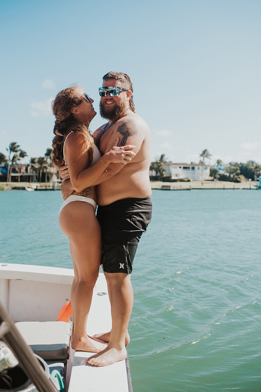 Bride and groom on side of boat
