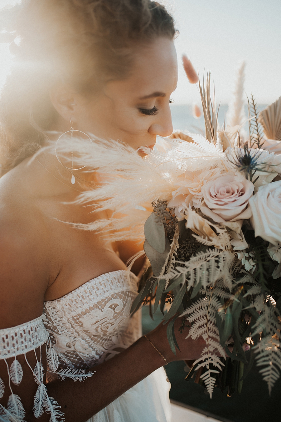Bride smelling bouquet