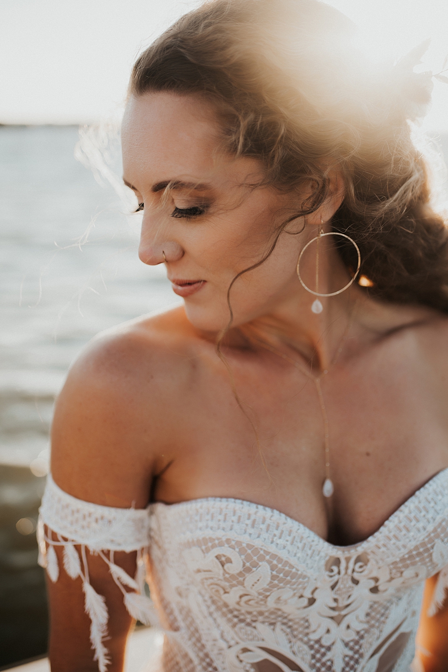 Bride with strapless corset dress and dainty jewelry