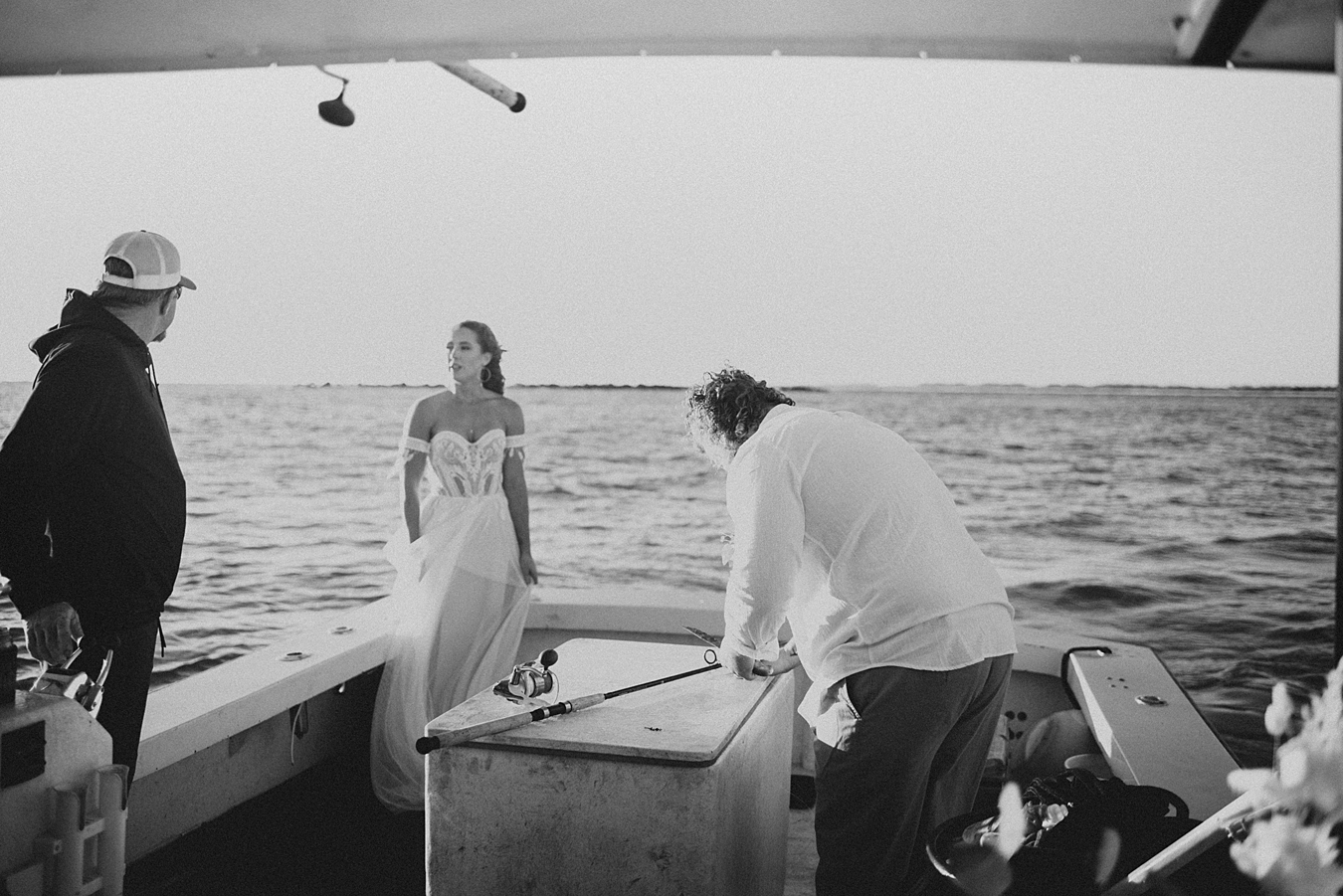 Groom fishing on back of boat
