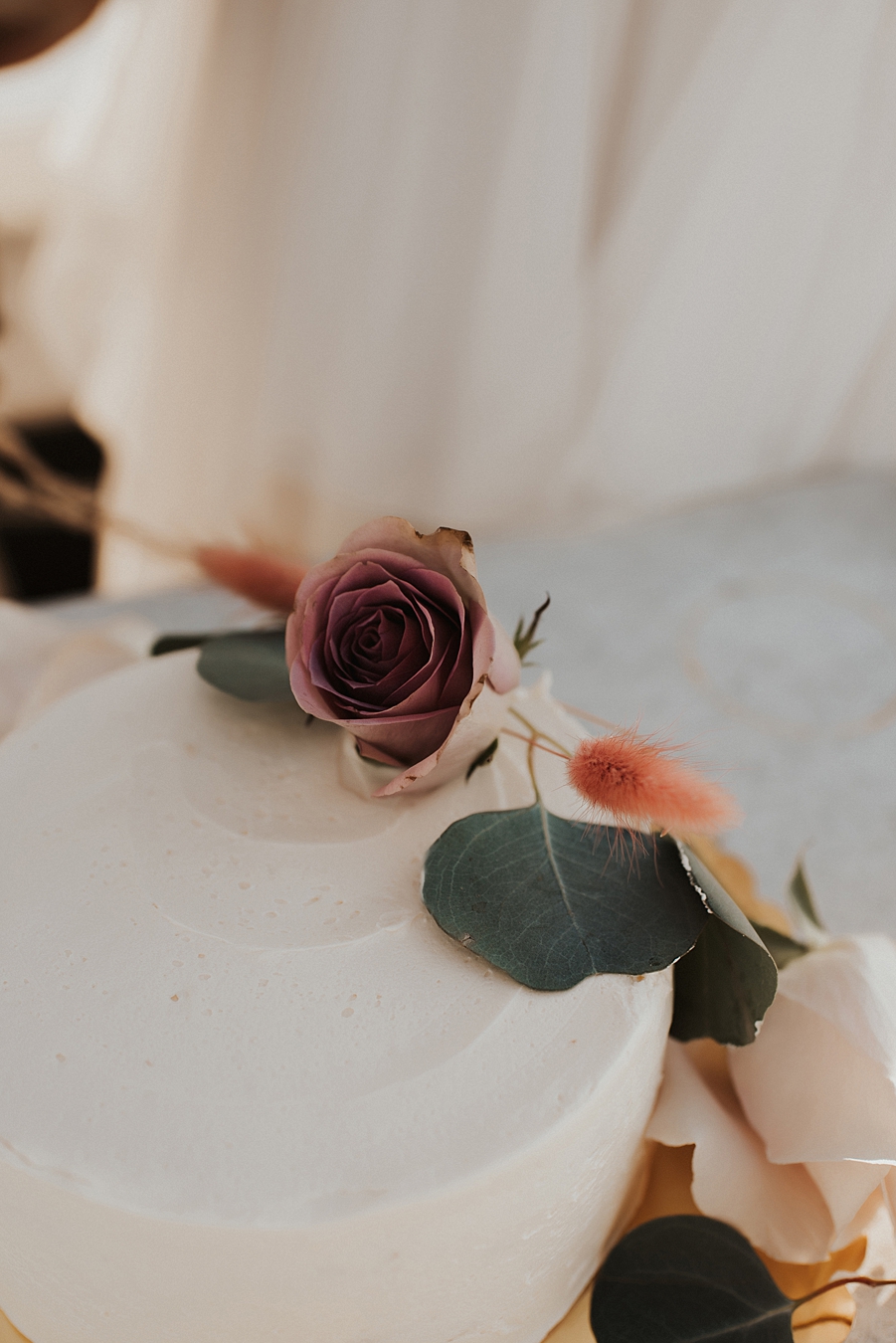 Simple elopement cake with greenery