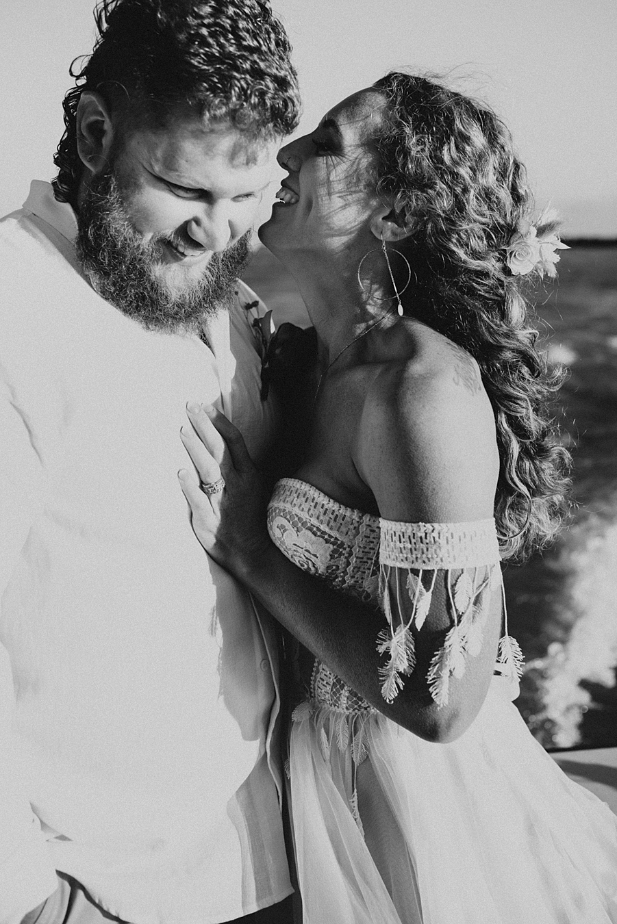 Bride whispering in grooms ear