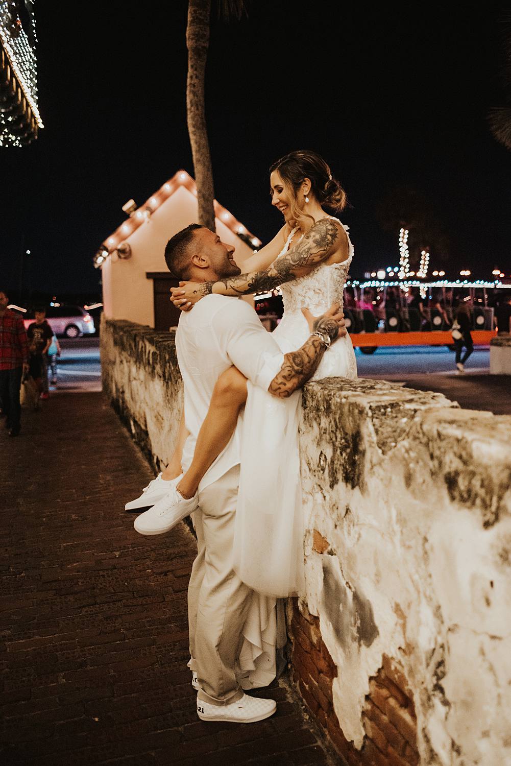 Bride sitting on a ledge