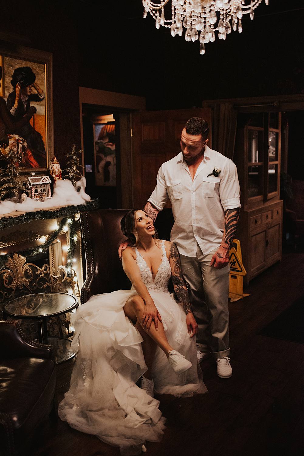 Bride sitting in front of fireplace at Tini Martini