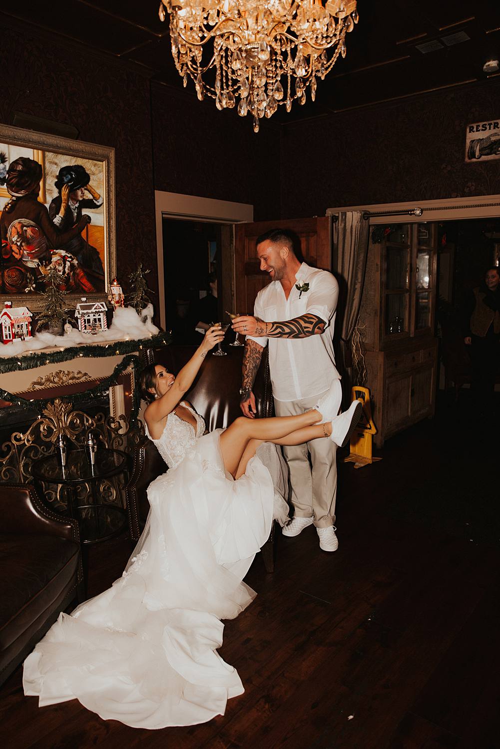 Bride and groom clinking martini glasses at tini martini