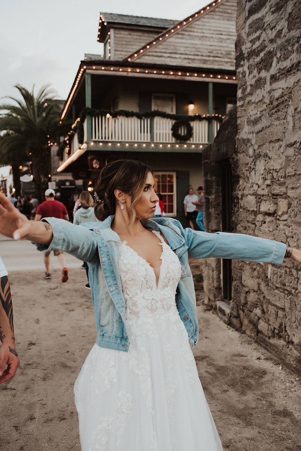 Bride wearing jean jacket on Saint George street