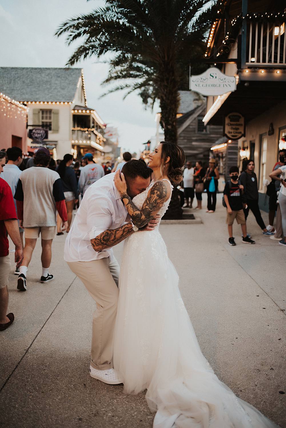 Bride and groom joking around on Saint George street