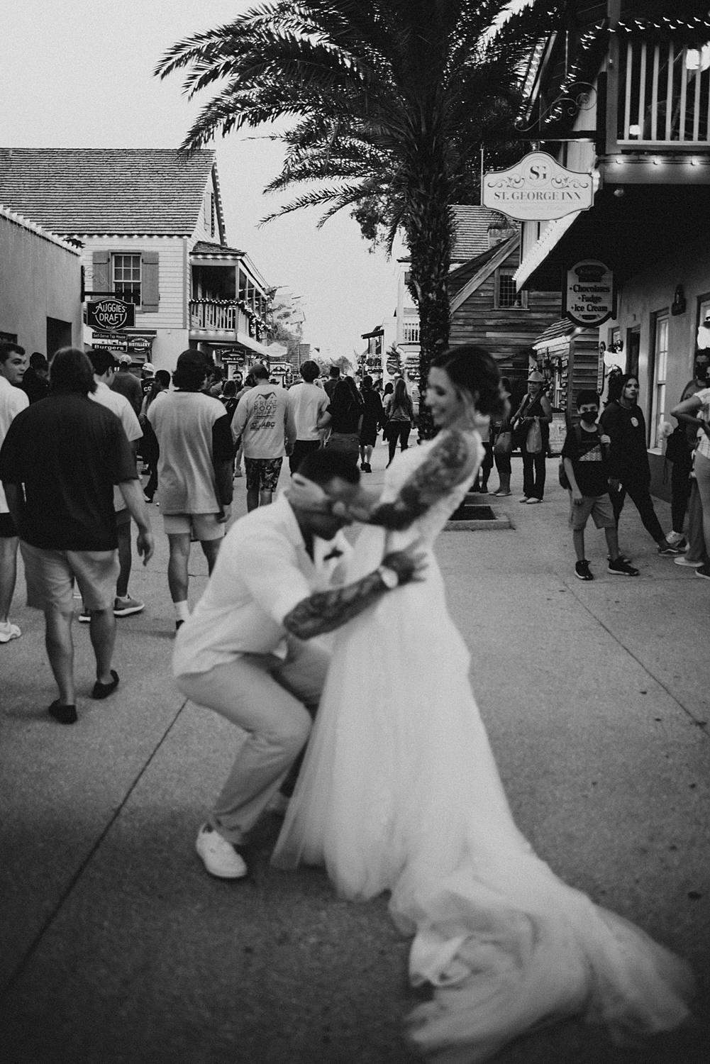 Bride and groom joking around on Saint George street