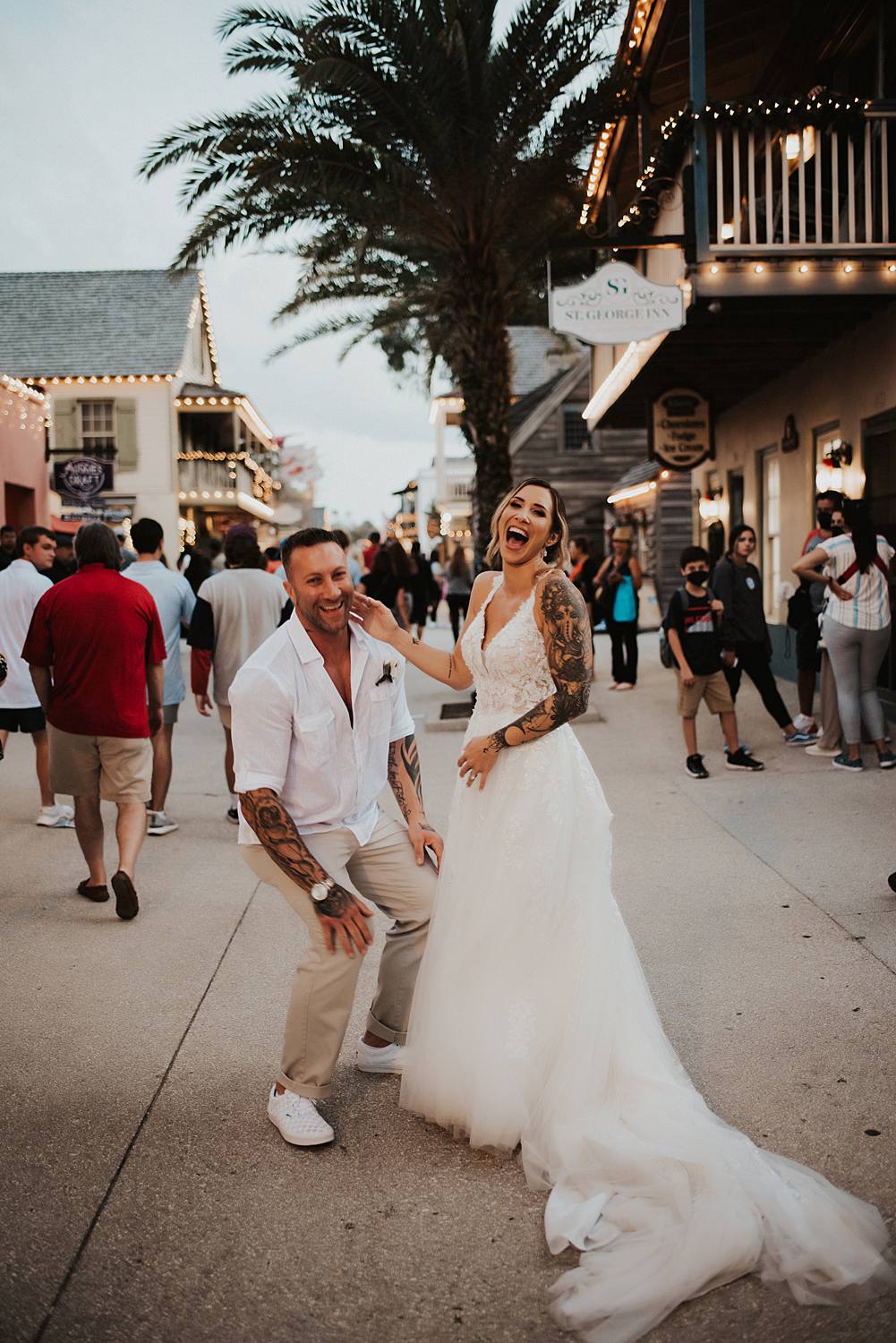 Bride and groom joking around on Saint George street