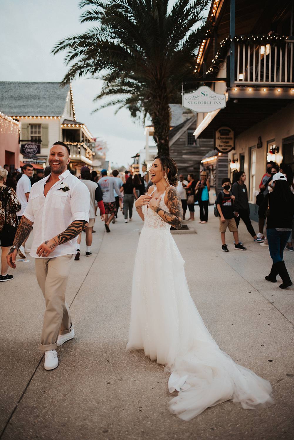 Bride and groom joking around on Saint George street