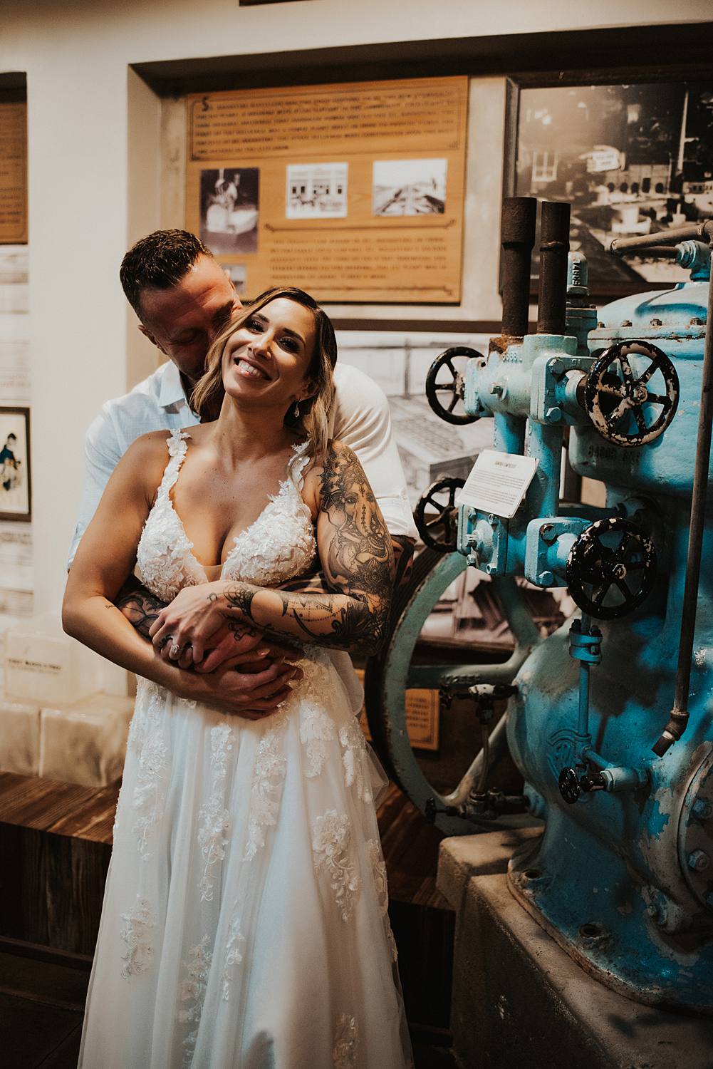 Bride and groom cuddling at Saint Augustine Distillery