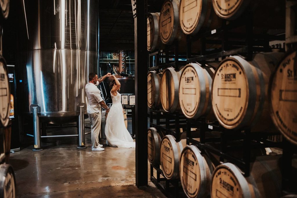 Bride and groom dancing at Saint Augustine Distillery
