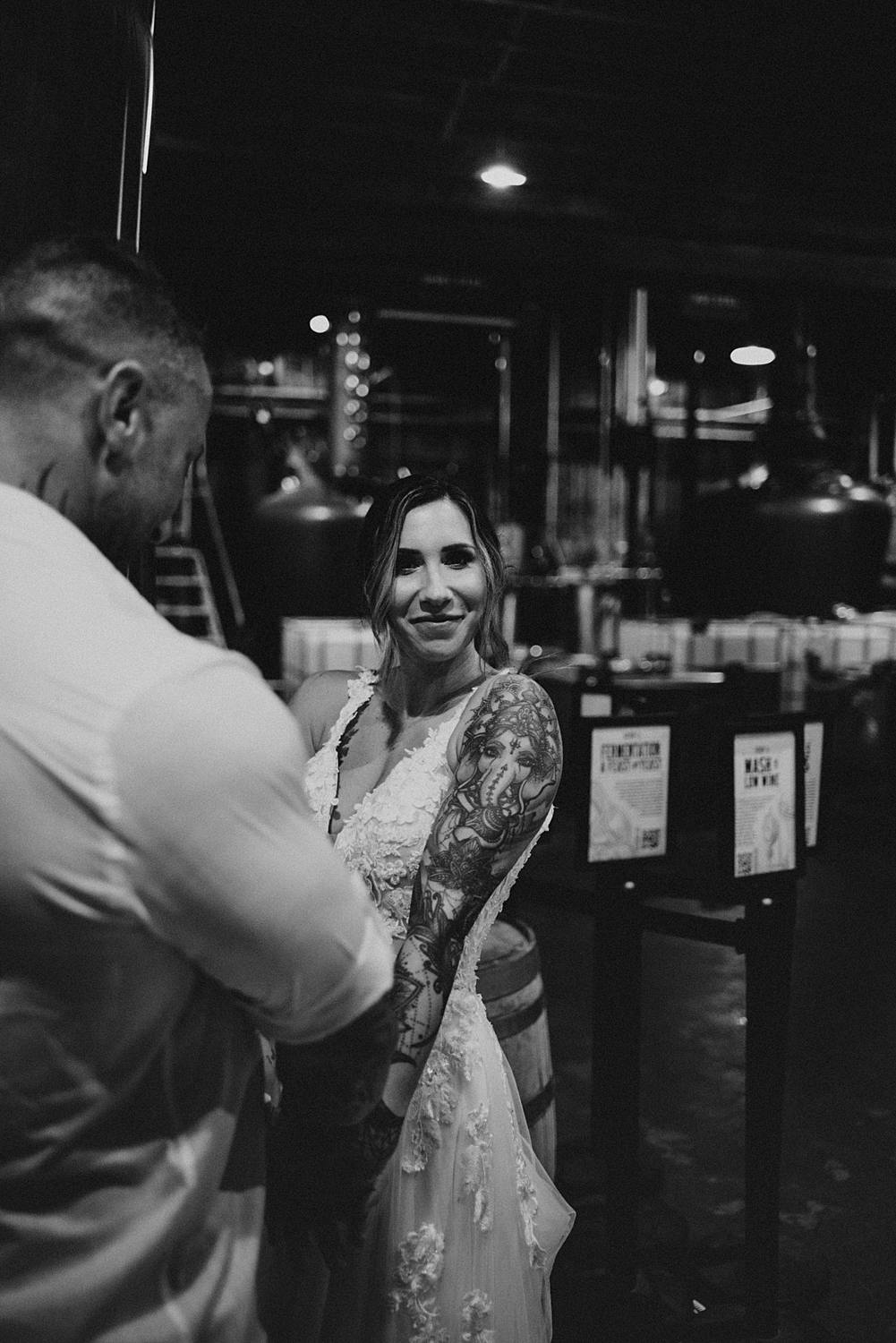 Bride and groom dancing at Saint Augustine Distillery