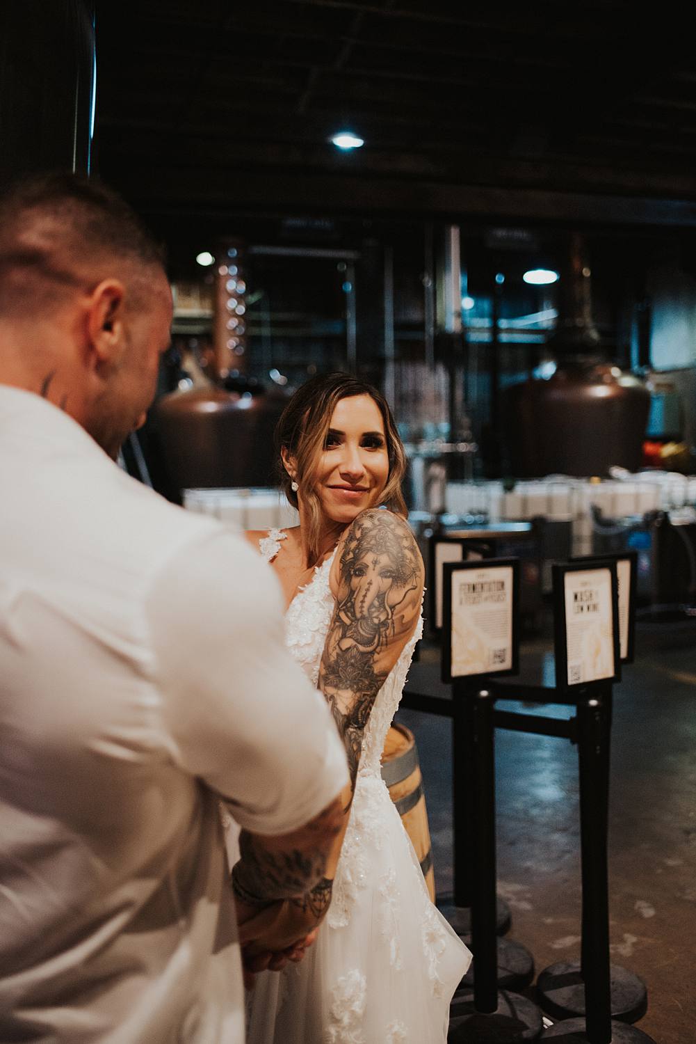 Bride and groom dancing at Saint Augustine Distillery