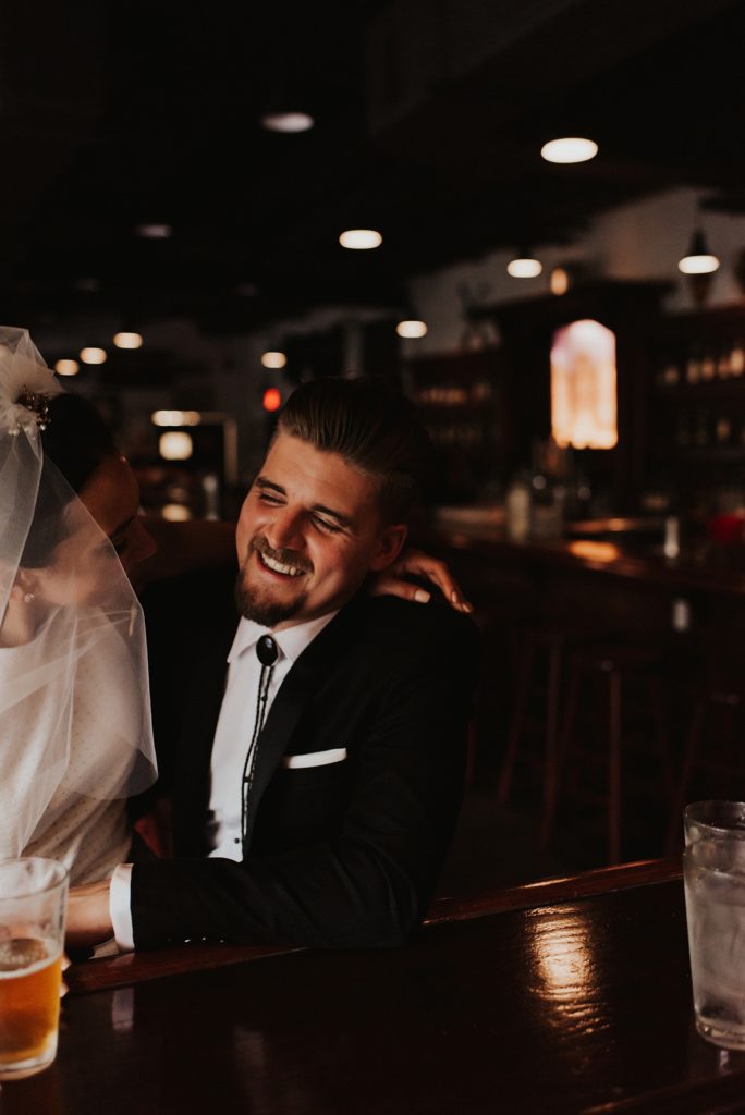 Bride and groom drinking craft beer in downtown tampa bar