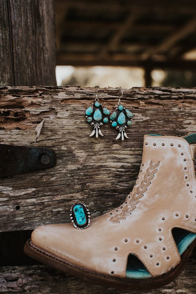 Detail photography of turquoise and silver wedding jewelry in Okeechobee barn