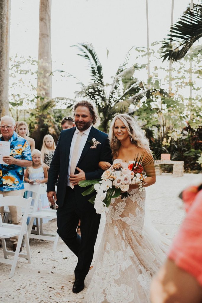 Father walking bride down the aisle at the historic walton house in homestead florida
