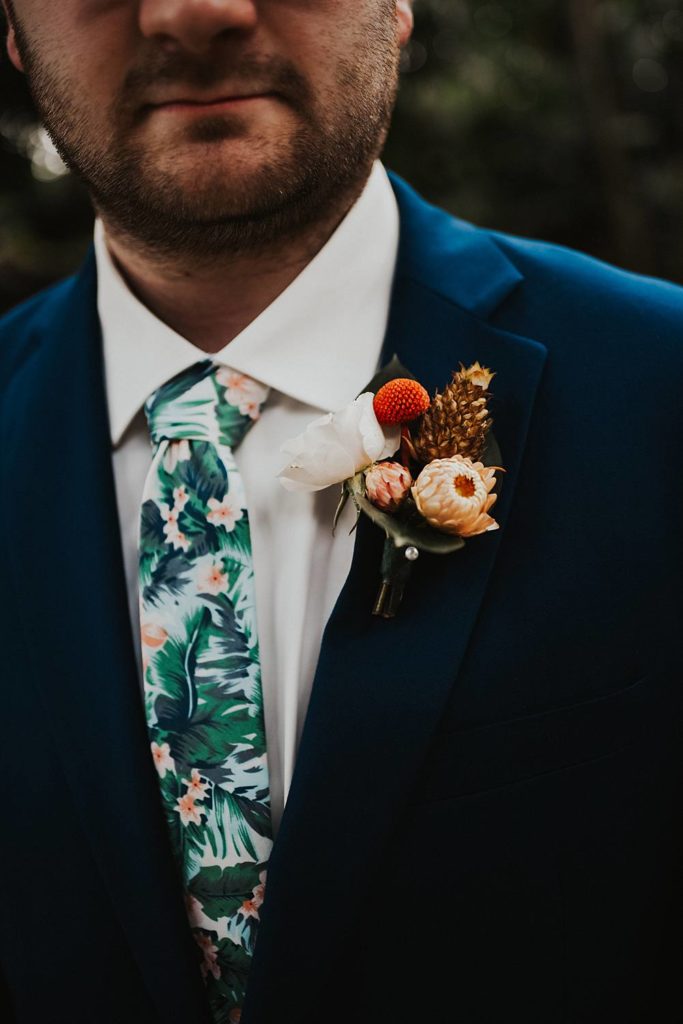 Tropical Boutonniere and tie on grooms lapel at the Historic Walton House in Homestead Florida