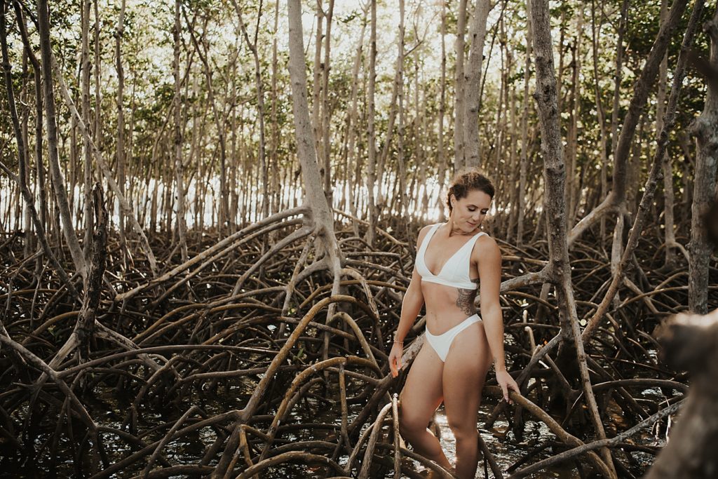 Bride in white bikini in mangroves