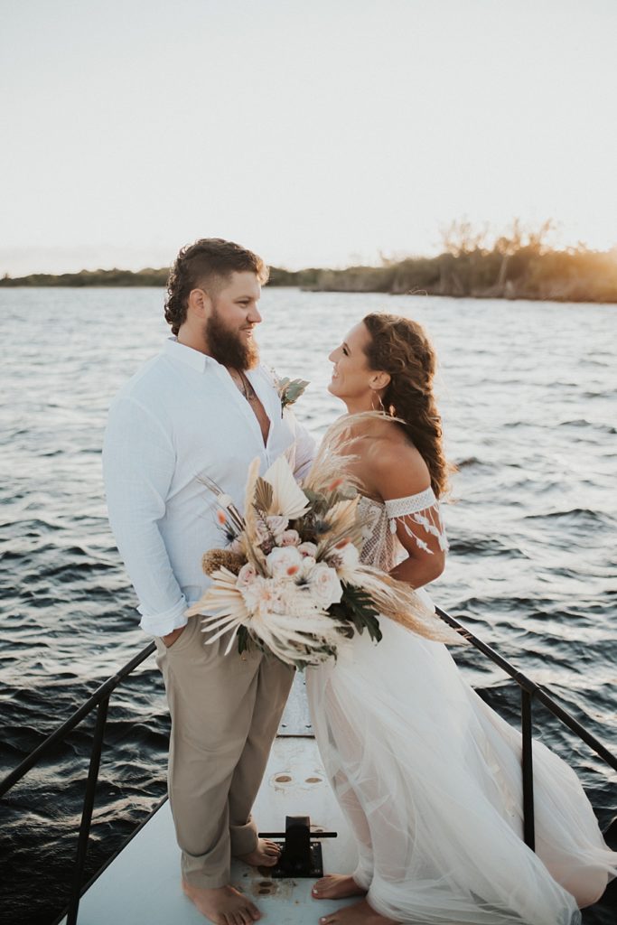 Bride and groom eloping on boat