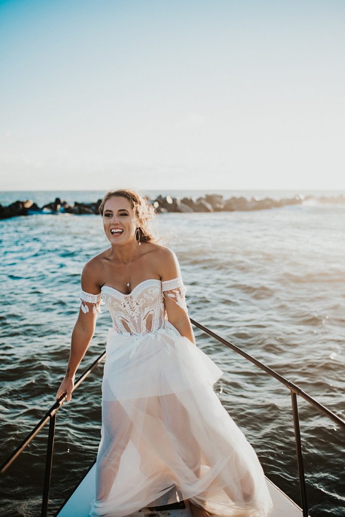 Bride on bow of boat