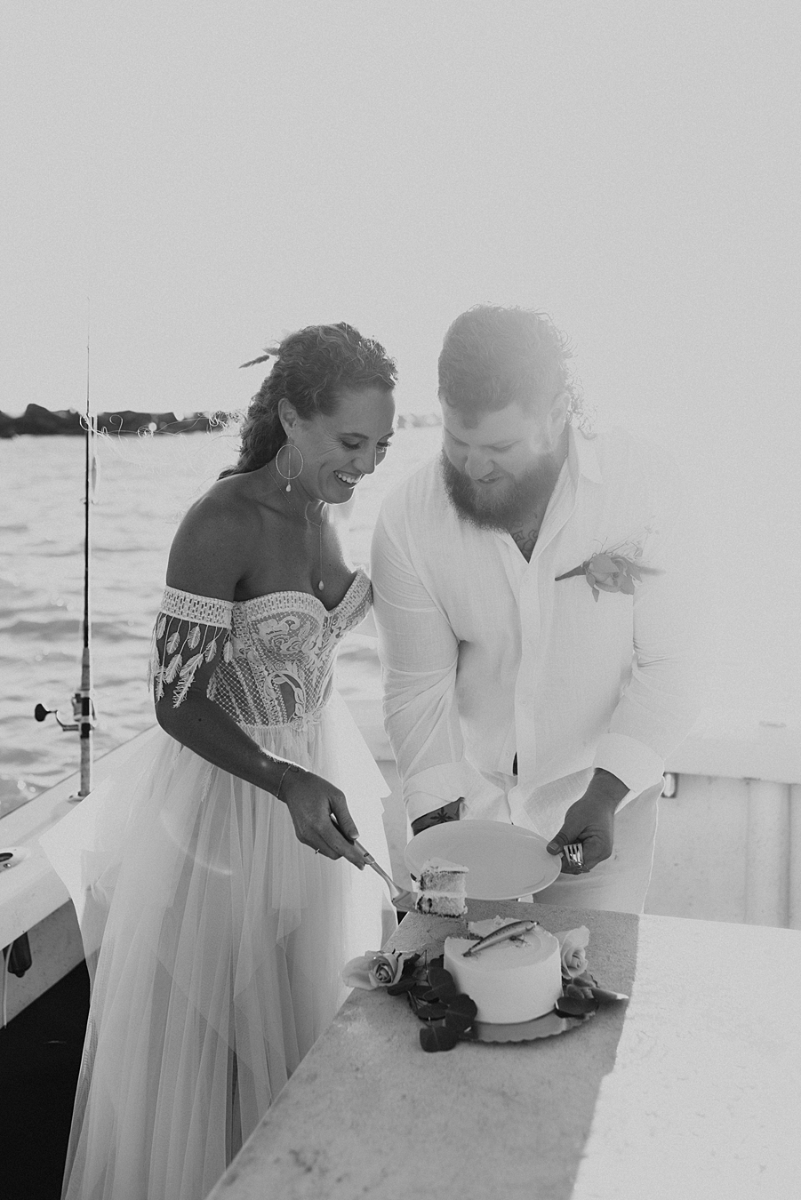 Eloping couple cutting cake