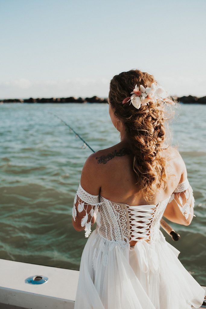 Bride fishing in corset dress
