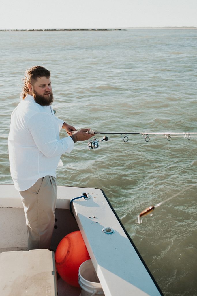 Groom fishing on boat