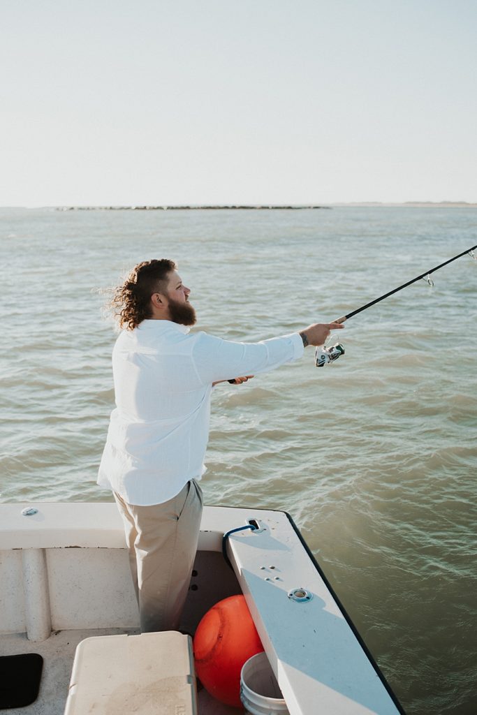 Groom fishing on boat