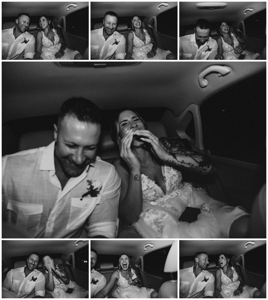 bride and groom laughing in back seat during car ride