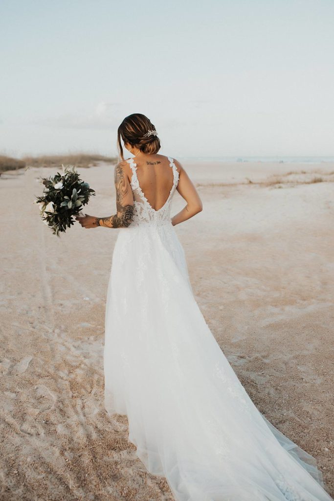Bride holding bouquet and walking away