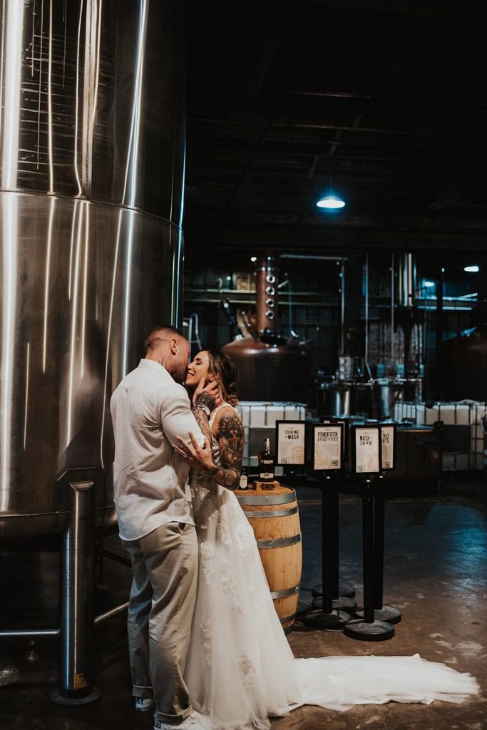 Bride and groom dancing at Saint Augustine Distillery