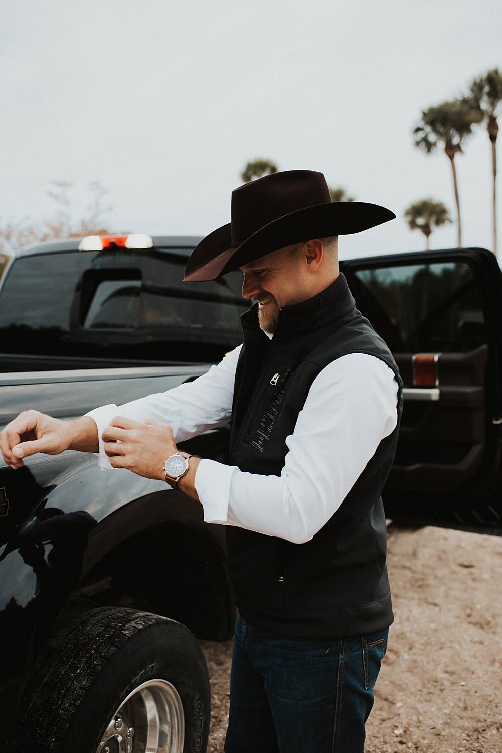 Groom getting ready at the beach for his Florida elopement