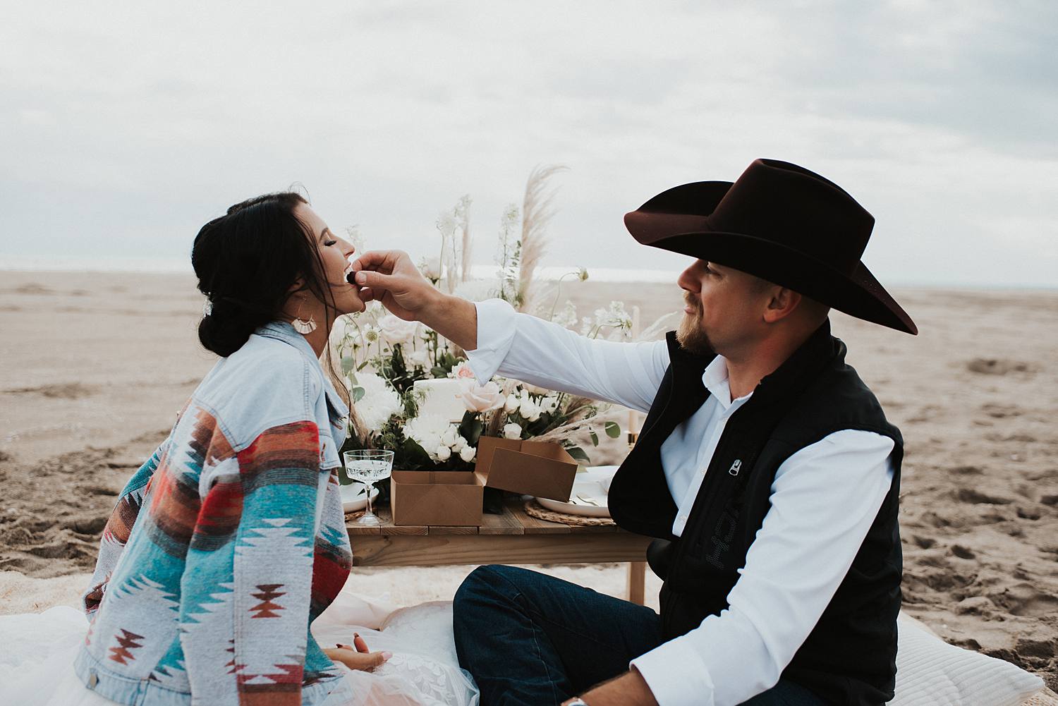 Bride and groom enjoying their luxury picnic on the beach after their Florida elopement