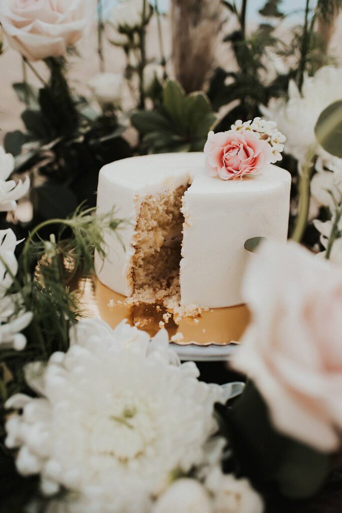 Cut cake inside floral cake meadow