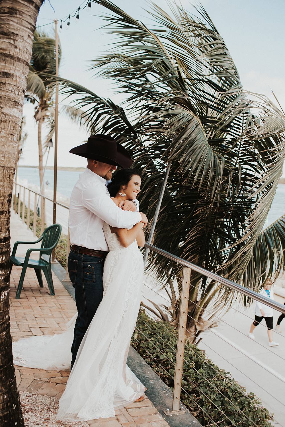 Bride and groom at beach bar for post celebratory drinks after their Florida beach elopement