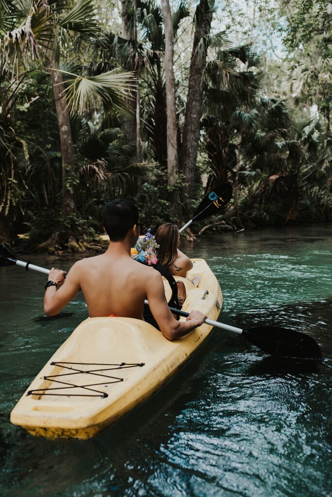 Couple kayaking at King's Landing during their Florida adventure elopement