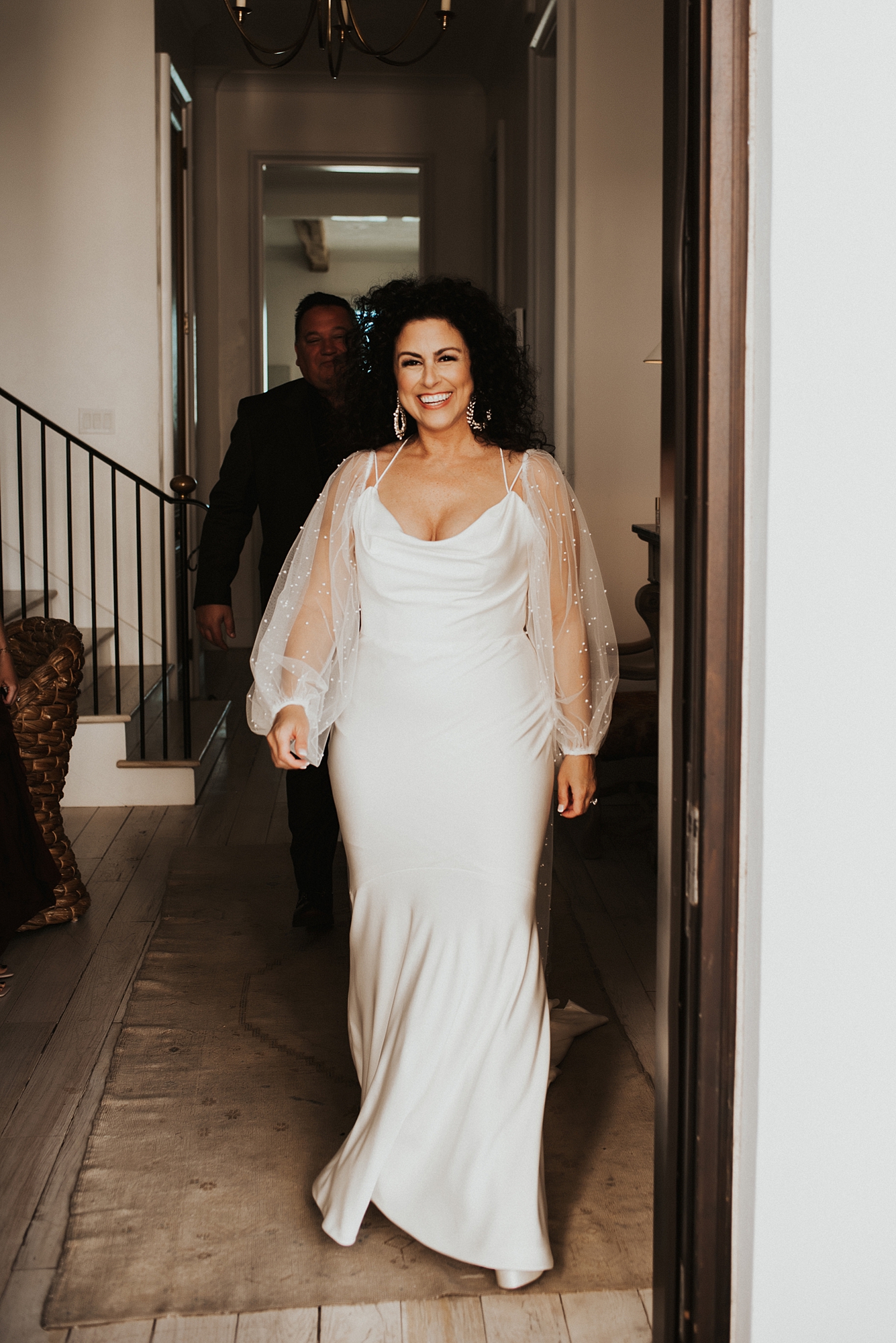 Bride walking down hallway