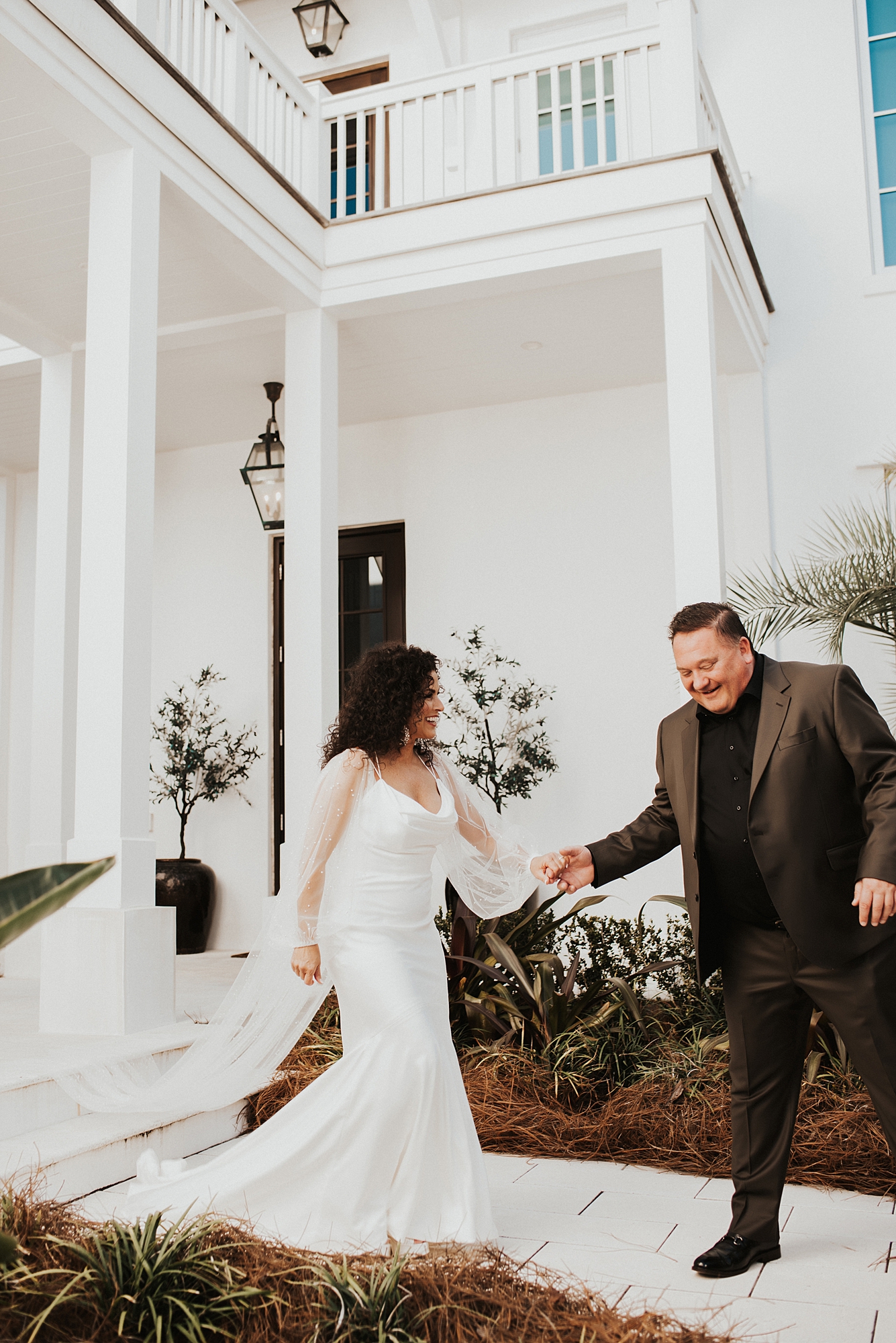 Groom leading bride from their AirBnB