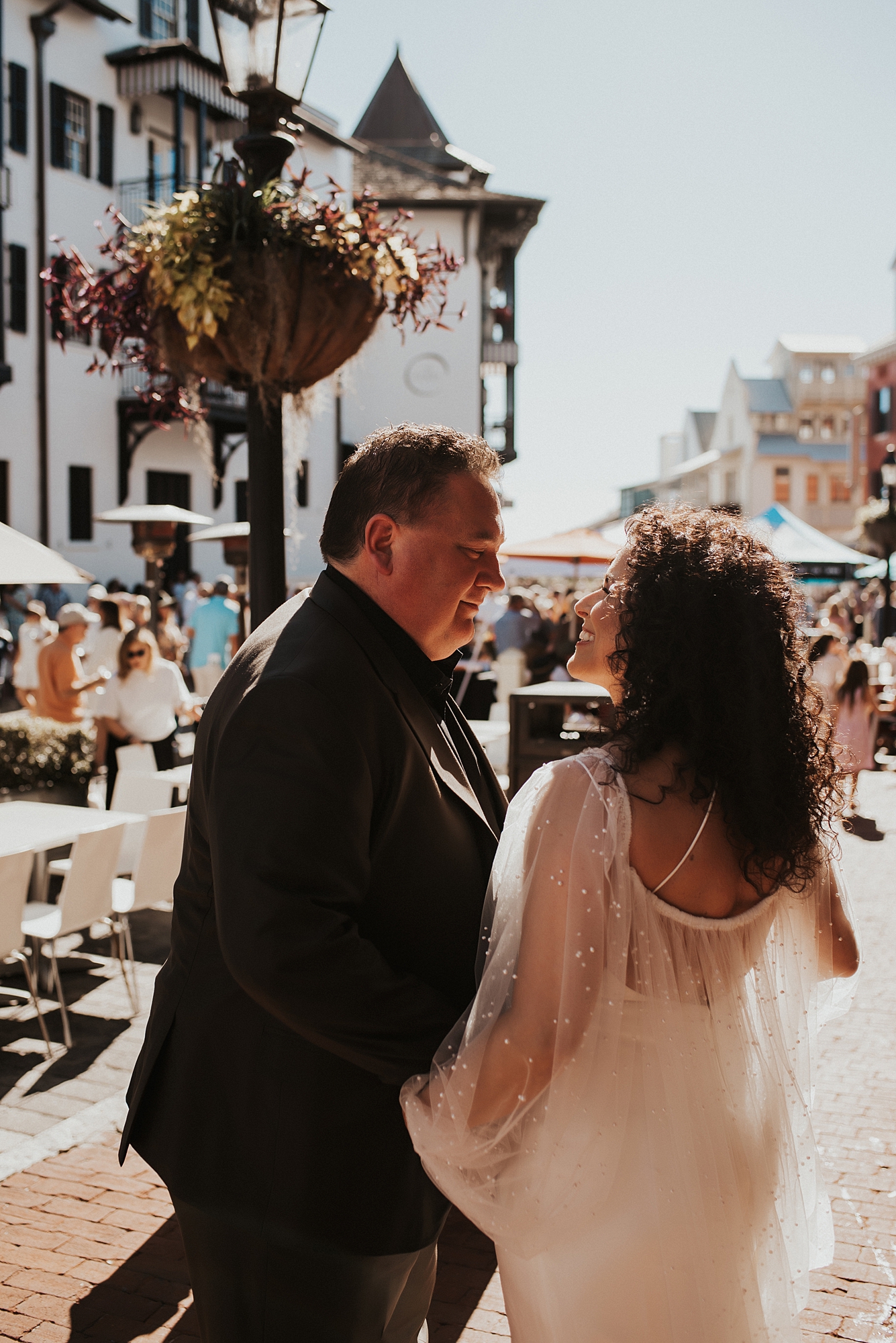 Bride and groom looking at each other in downtown Rosemary Beach