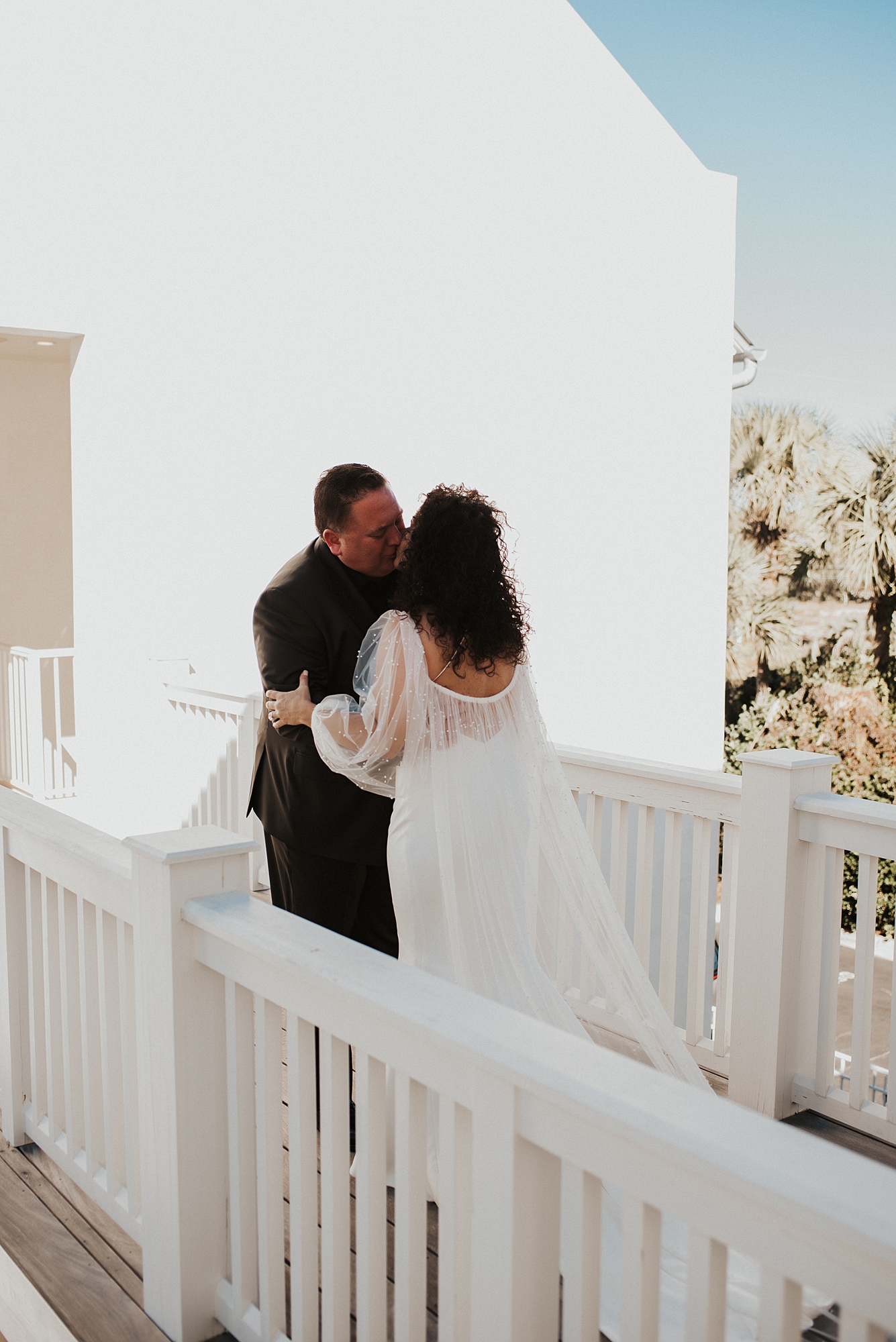 Groom and bride sharing a kiss after first look 